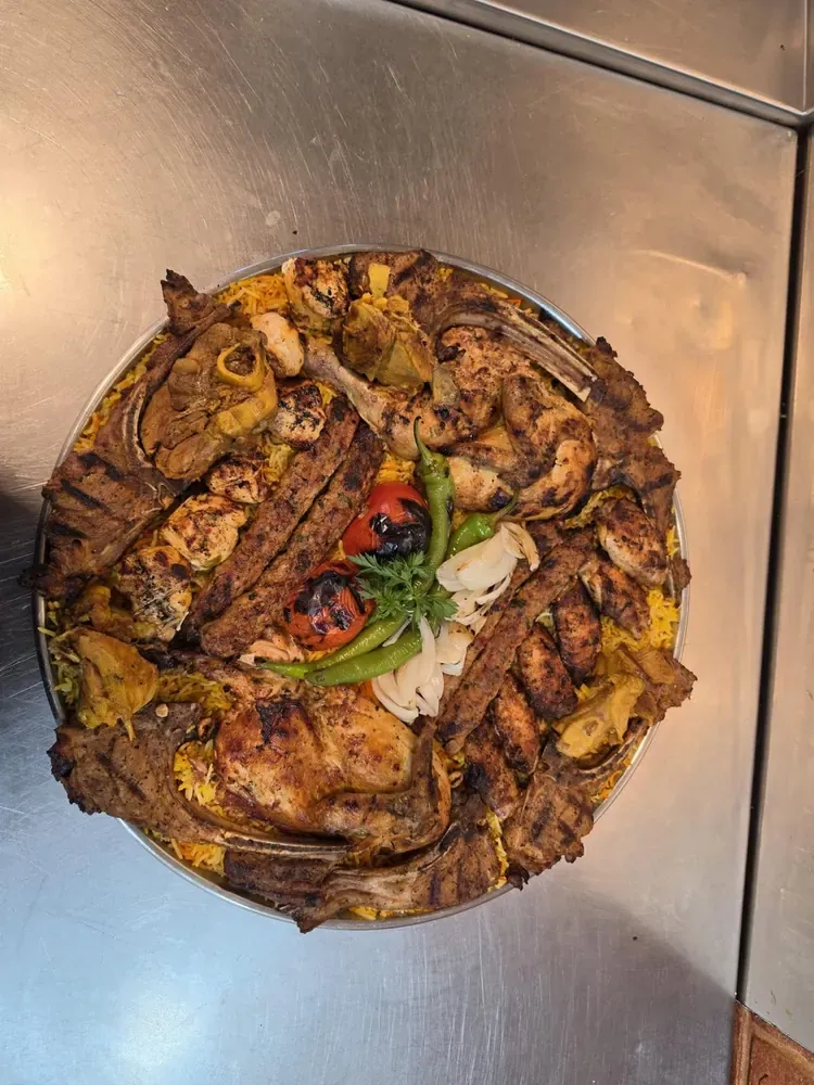 Lamb Mandi - tender lamb on a bed of saffron-spiced basmati rice