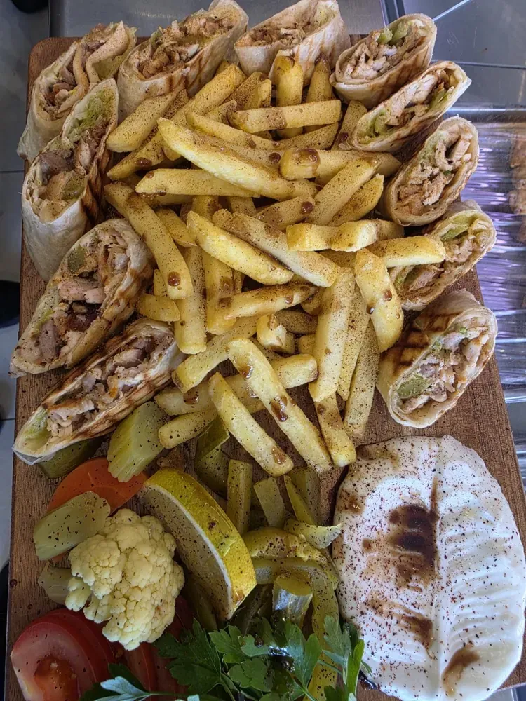 Mixed grill platter with lamb chops, kofta kebabs, shish taouk and saffron rice